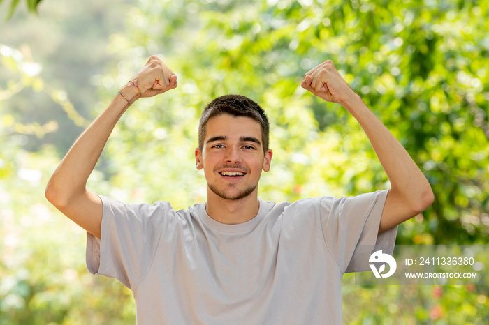 smiling young man with expression of happiness and success