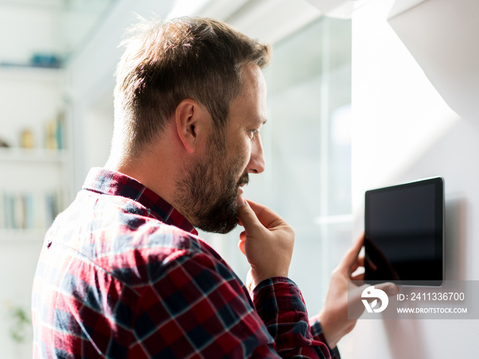 Man using smart home device