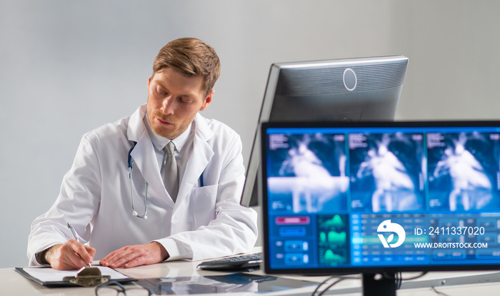 Professional medical doctor working in hospital office using computer technology. Medicine, cardiology and healthcare.