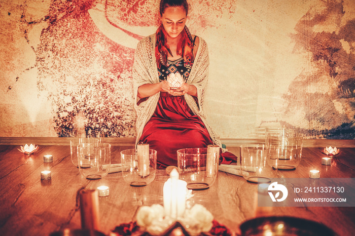 soundhealing, beautiful woman playing crystal bowls on cacao ceremony.