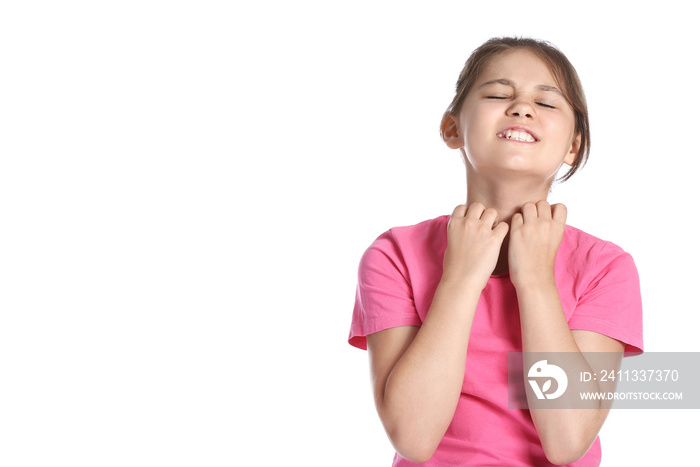 Little girl scratching herself on white background