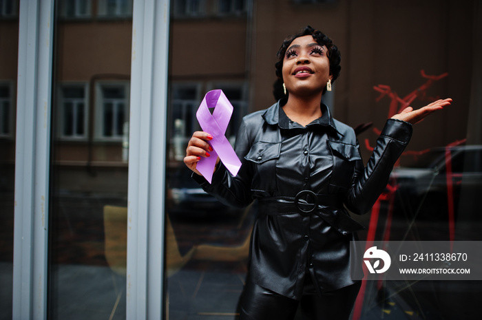 World Cancer Day concept, February 4. African american woman hold purple ribbon awareness.