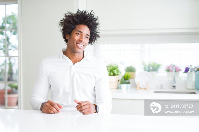 African American man looking away to side with smile on face, natural expression. Laughing confident.