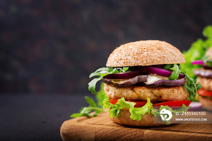 Sandwich juicy spicy chicken burgers with tomato and eggplant