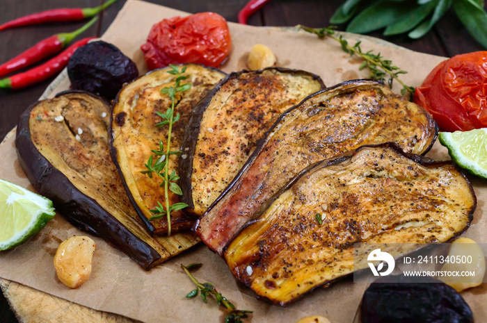 Baked eggplant with herbs and spices. Vegetarian cuisine.