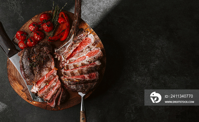 grilled beef steak on a dark background. expensive marbled beef of the highest grade fried to rare on the grill