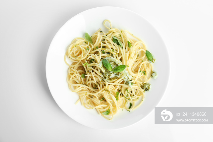 Plate with delicious pasta on white background