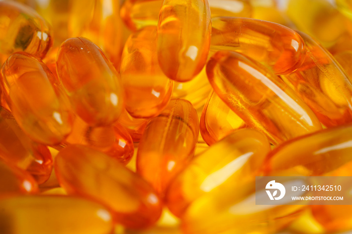 Fish oil or Cod liver oil gel in capsules with omega 3 vitamins, supplementary healthy food .