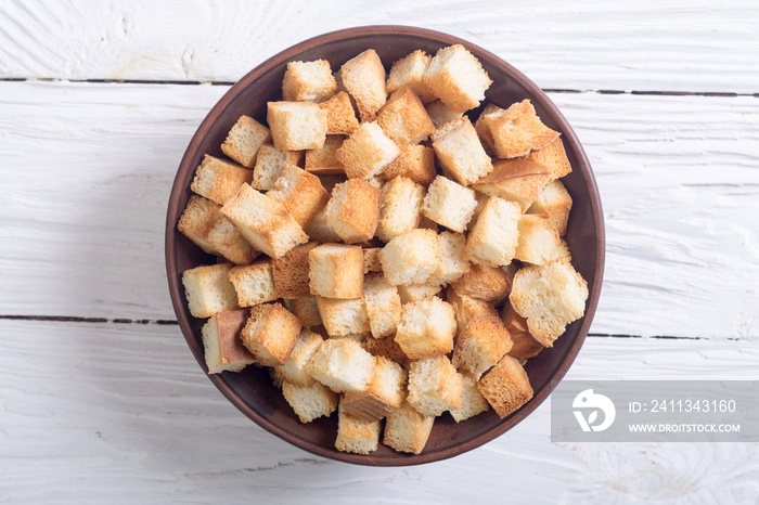 Crispy croutons in bowl