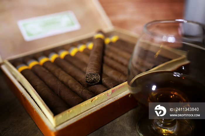 Large box of Cuban cigars on a wooden table