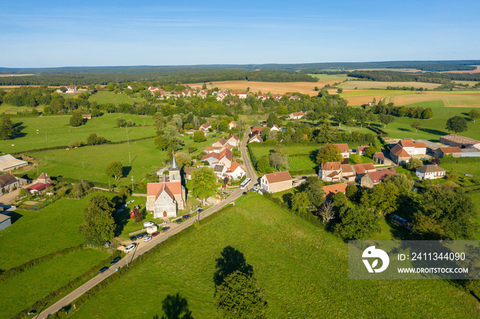 The traditional French village of Cuncy les Varzy and its church in Europe, France, Burgundy, Nievre, in summer on a sunny day.