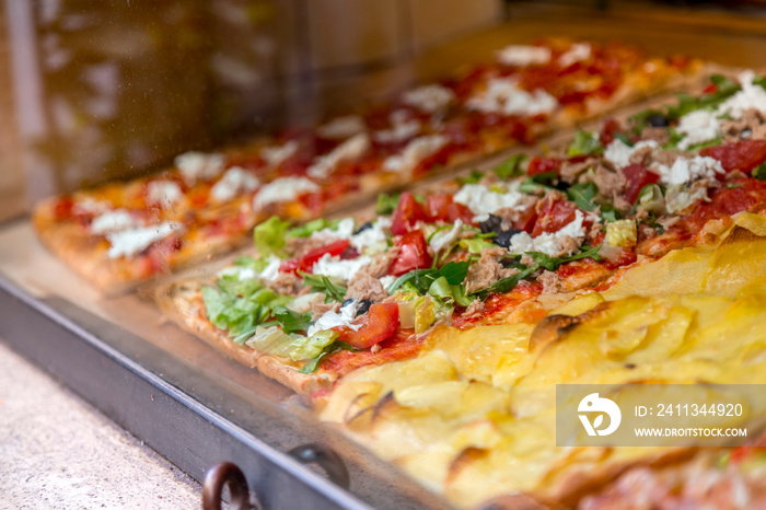 Italian pizza in a restaurant display window in Rome