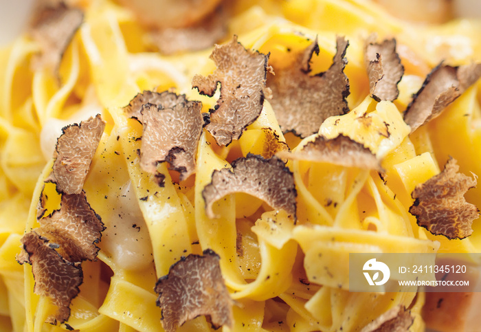 Pasta with truffles, typical autumn dish.Restaurant menu dish.