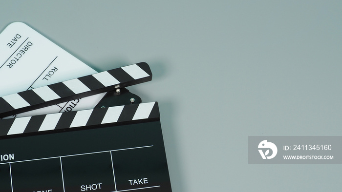 Black and white Clapperboard or clapper board or movie slate use in video production ,film, cinema industry on gray background.