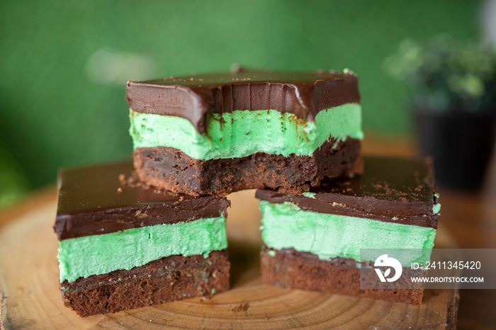 Mint brownies on wood with green background