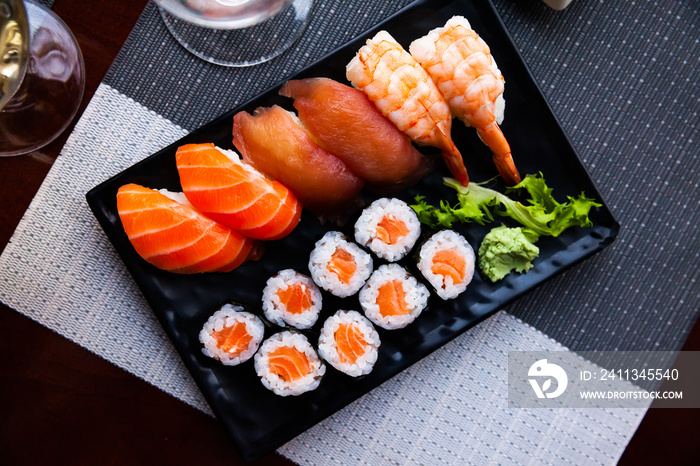 Combined sushi - maki salmon, nigiri variado closeup. Japanese cuisine