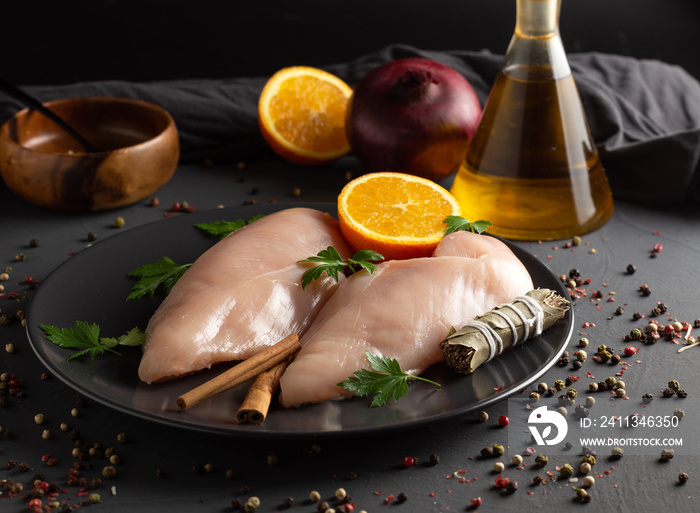 Raw chicken breasts prepared for cooking with ingredients