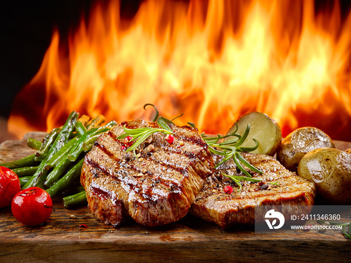 freshly grilled steaks and vegetables