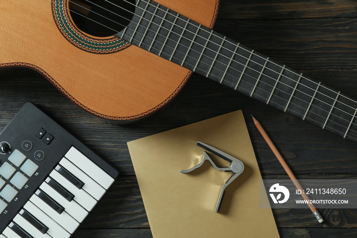 Music maker composition on wooden background, top view