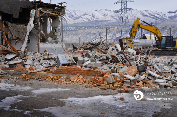 Heavy Equipment Tearing Down Building Construction