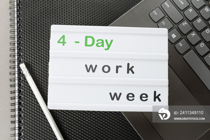 Symbol of the 4-day work week. A place to copy. Business and the concept of a 4 or 5 day work week. focus on the caption. The concept of a four- or four-day workweek