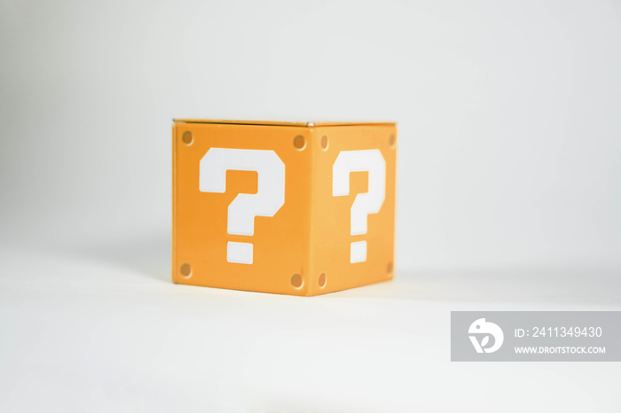 orange metal toy blocks with a question mark