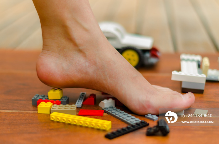 A feet standing up on Legos of various colors