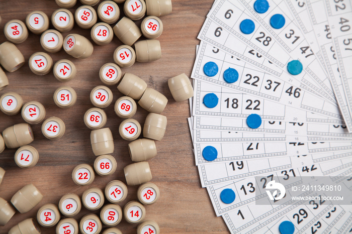 Barrels with numbers and cards for lotto table game.