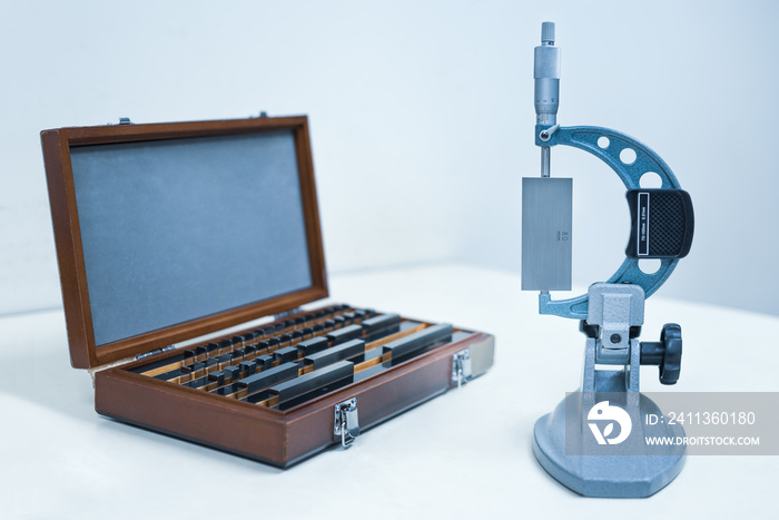 Micrometer Calibration with gauge block in laboratory factory.