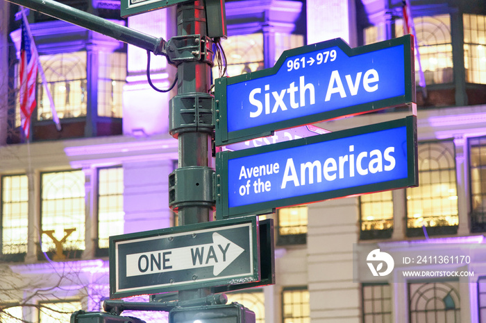 Sixth Avenue - Avenue of the Americas sign at night in Manhattan, New York City