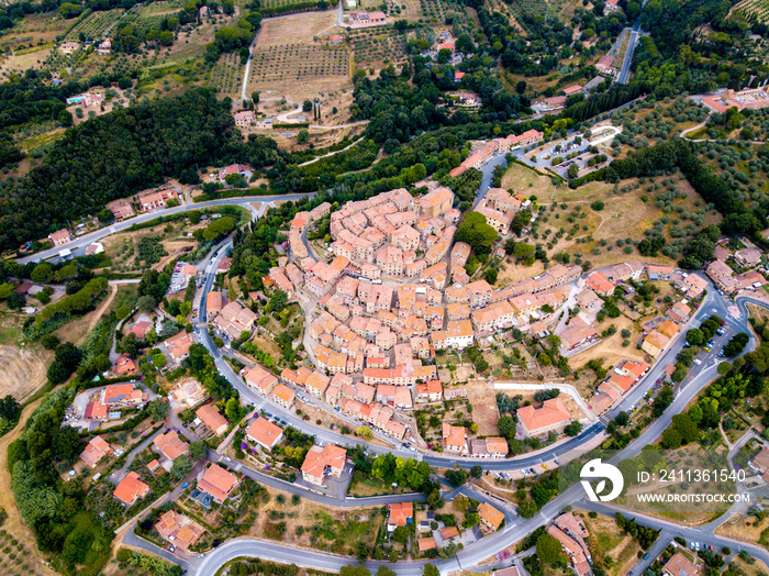 Casale Marittimo, Tuscany, Pisa region, Medieval old town with cypress tress and crops hay, city on a hill top, landscape drone aerial panorama