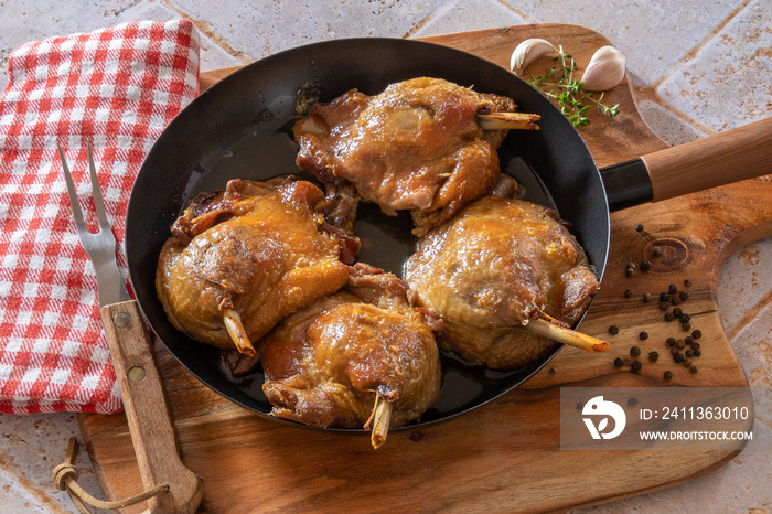 duck confit cooked in a dish