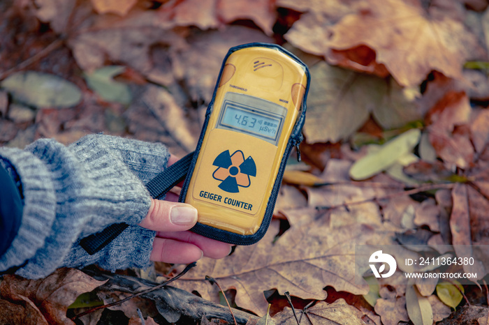 Checking radiation level with a personal dosimeter. Pripyat city in Chernobyl Exclusion Zone, Ukraine