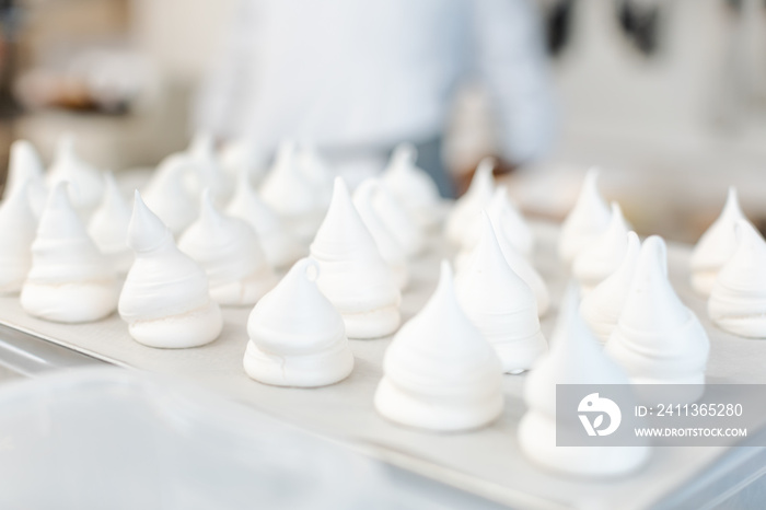 Meringue on a tray in pastry shop