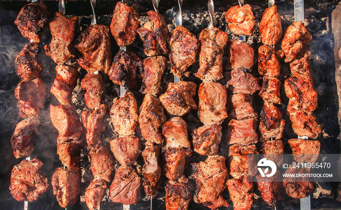 The meat is fried on the grill. Selective focus.