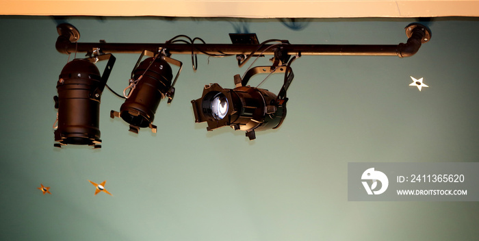 Set of multiple spotlights at theater ceiling for stage illumination