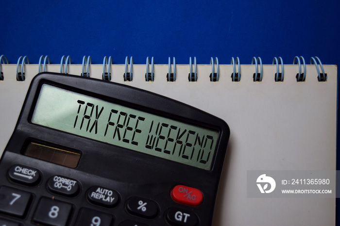 Tax Free Weekend write on the calculator on Office Desk.