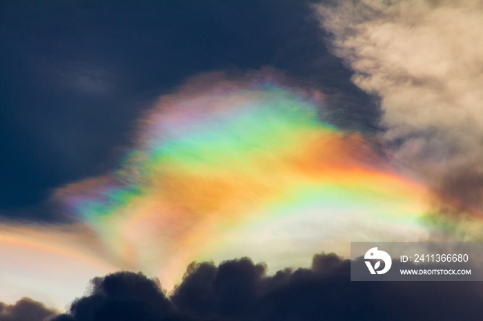 Beautiful iridescent cloud, Irisation. Skyscraper background.