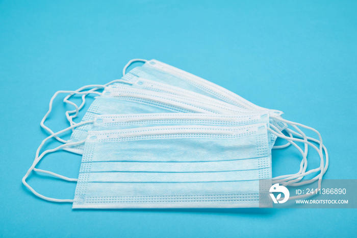 Medical masks on a blue background. Coronavirus