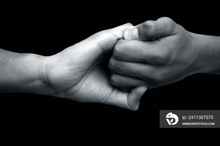 Isolated hands of male teenagers doing Ganesha Yoga Mudra with two hands-on black background.Horizontal shot.