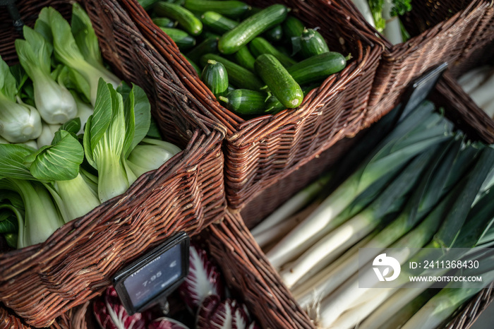 fresh green vegetables on the counter of the bio store