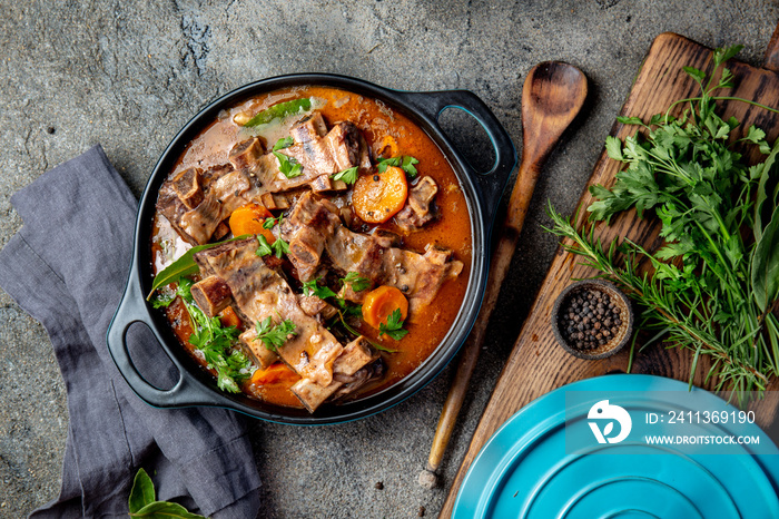 Beef ribs Bourguignon. Beef ribs stewed with carrot, onion in red wine. France dish