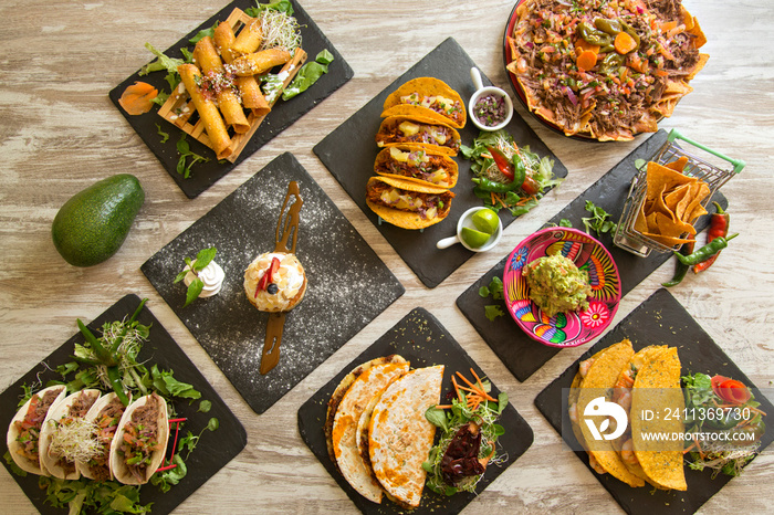 Table with typical Mexican food seen from above.