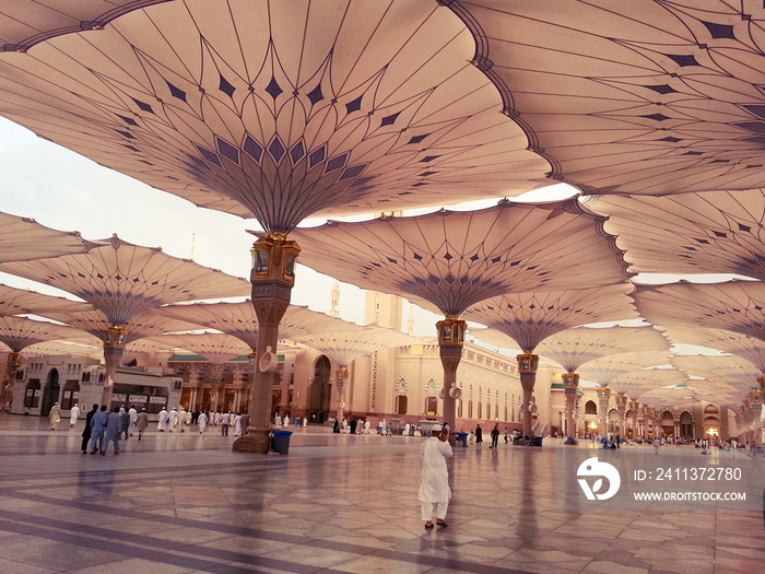 Medina / Saudi Arabia - 16 Sep 2013 : Muslim pilgrims entering to Masjid al-Nabawi ( Prophet’s Mosque ) for the Maghrib prayer.