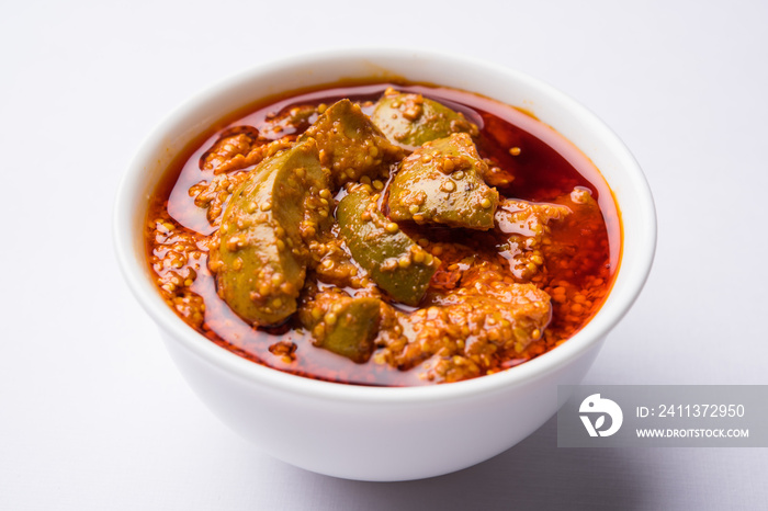 Homemade Mango Pickle or aam ka achar or achaar in white bowl, selective focus