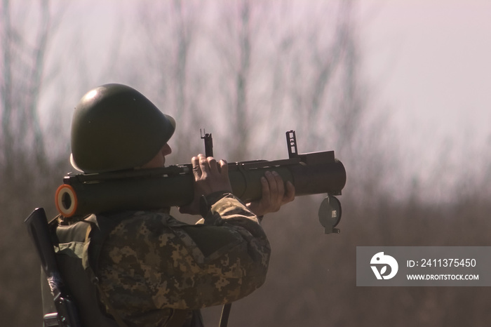 Military shooting from bazooka at warfield