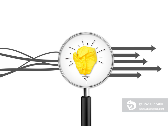 Magnifying glass with crumpled paper light bulb with question tags metaphor for good idea