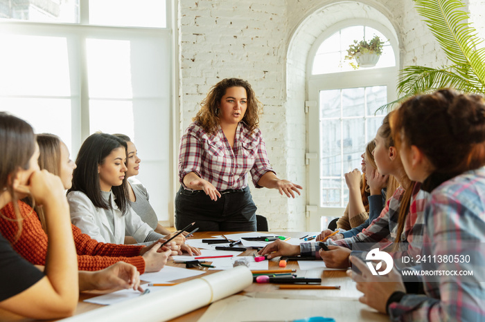 Teamwork. Young people discussing about women rights and equality at the office. Caucasian businesswomen or office workers have meeting about problem in workplace, male pressure and harassment.