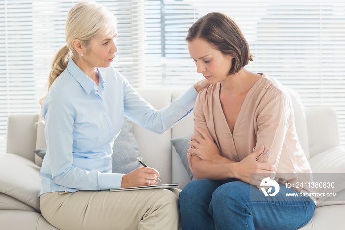 Therapist talking to patient