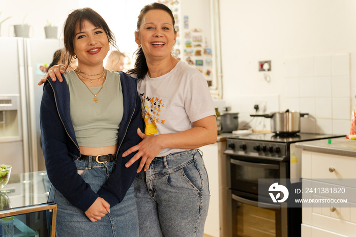 Portrait of two women in domestic kitchen